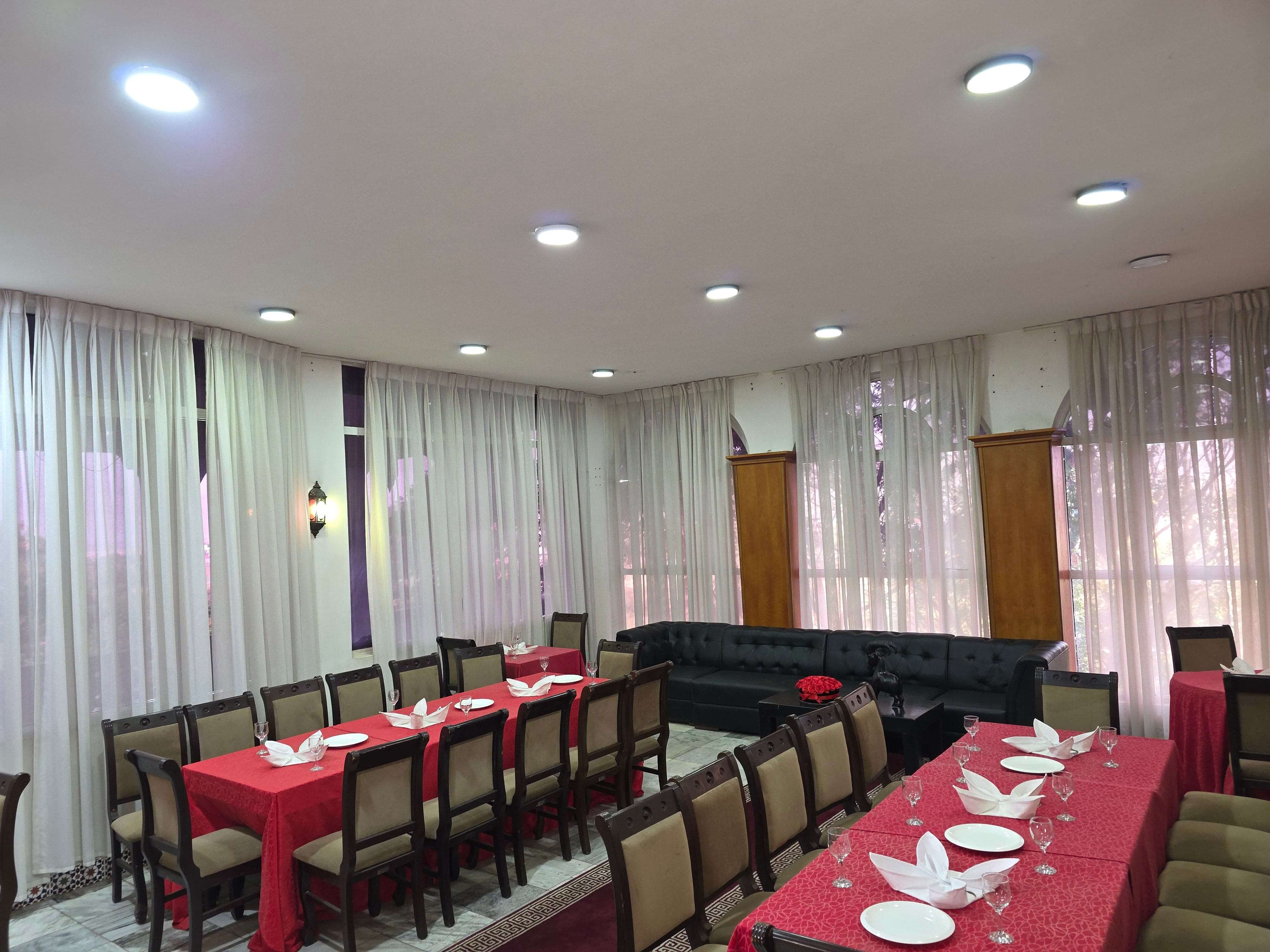 ODA Resort signature restaurant with candlelit tables and chandeliers
